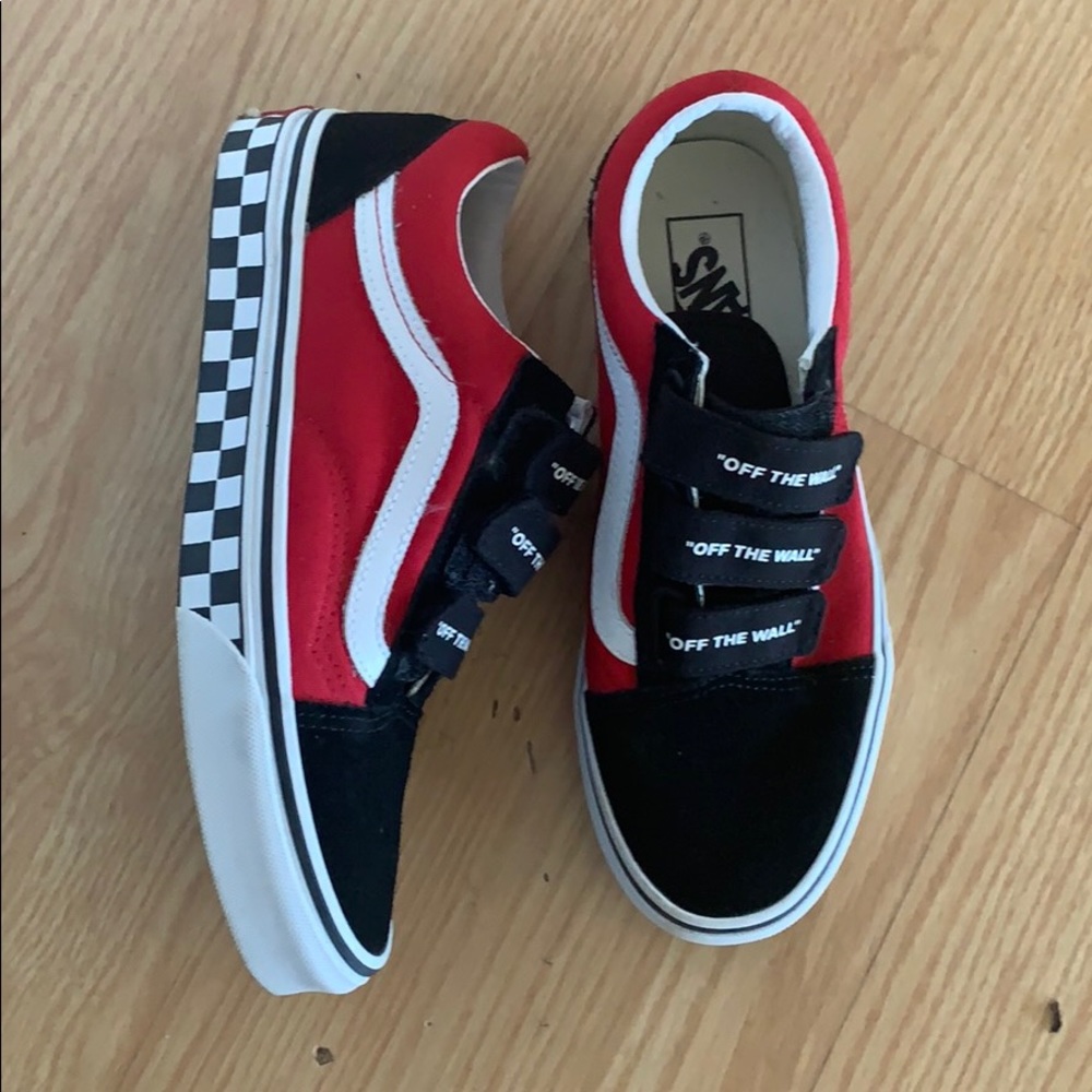 Red Vans, black soles, checkered rims